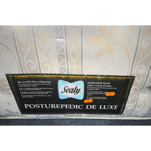 1258 - A SEALEY POSTUREPEDIC DE LUXE SINGLE MATTRESS, with a pine bedstead (condition report: bedstead sun ... 