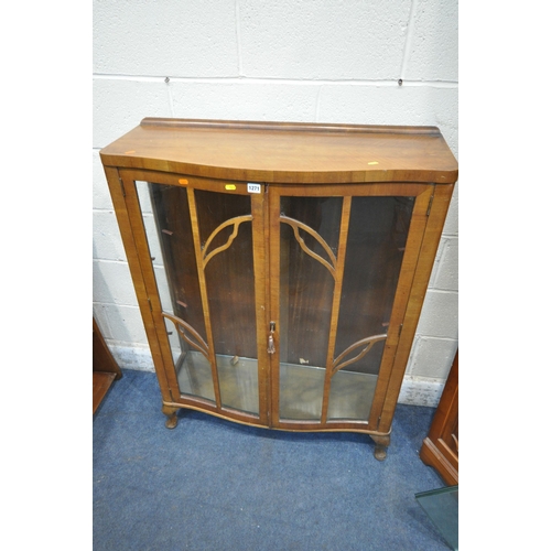 1271 - A 20TH CENTURY SERPENTINE DISPLAY CABINET, with double glazed doors, enclosing two glass shelves, ra... 