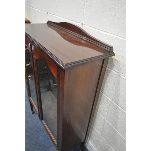 1272 - AN EDWARDIAN MAHOGANY BOOKCASE, with double glazed doors, raised on square tapered legs, with spade ... 