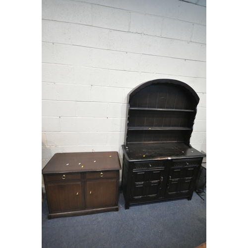 1283 - A 20TH CENTURY OAK DRESSER, the arched two tier plate rack, atop a base with two drawers and double ... 