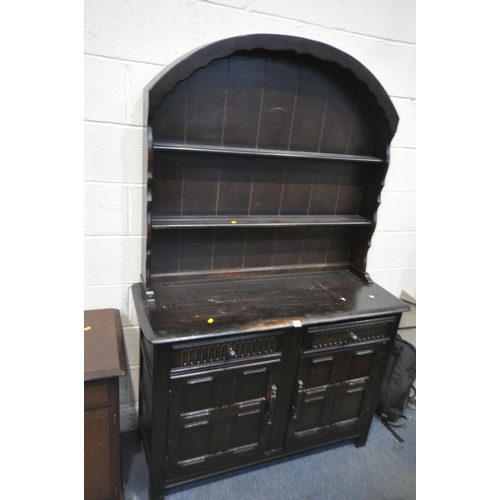 1283 - A 20TH CENTURY OAK DRESSER, the arched two tier plate rack, atop a base with two drawers and double ... 