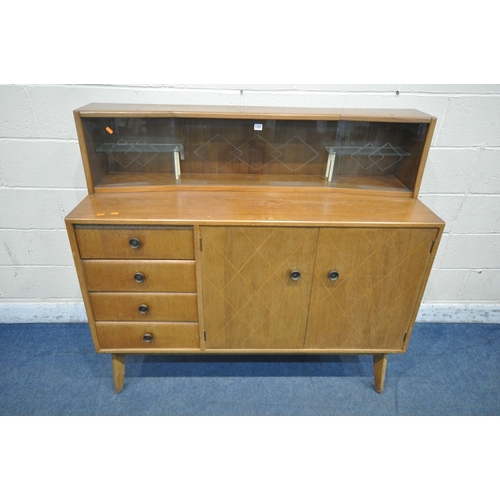 1291 - A MID CENTURY TEAK SIDEBOARD, the raised back with a glass sliding door, that's enclosing two small ... 