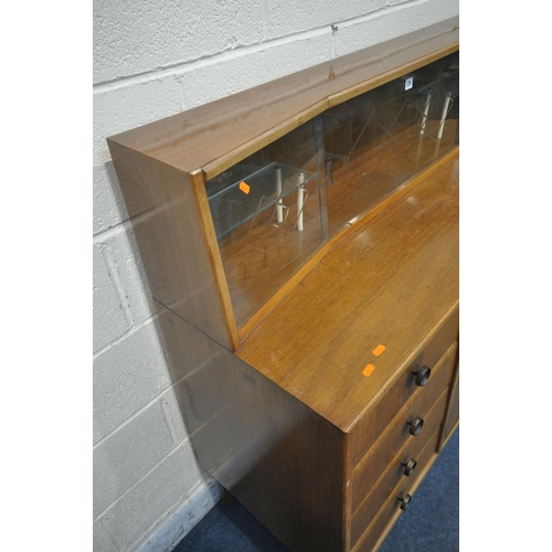 1291 - A MID CENTURY TEAK SIDEBOARD, the raised back with a glass sliding door, that's enclosing two small ... 