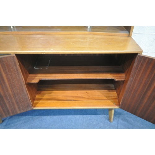 1291 - A MID CENTURY TEAK SIDEBOARD, the raised back with a glass sliding door, that's enclosing two small ... 