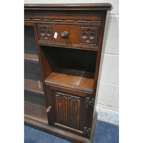 1294 - AN OLD CHARM BOOKCASE, the double glass sliding doors enclosing two shelves, the single drawer above... 