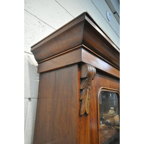 1296 - A VICTORIAN MAHOGANY BOOKCASE, the double glazed doors enclosing three shelves, atop a base with a s... 