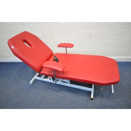 1322 - A RED LEATHERETTE ELECTRIC RISE AND FALL MASSAGE BED, with adjustable mechanisms, along with a stool... 