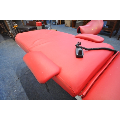 1322 - A RED LEATHERETTE ELECTRIC RISE AND FALL MASSAGE BED, with adjustable mechanisms, along with a stool... 