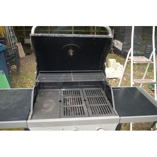 1001 - A BLOOMA THREE BURNER GAS BARBEQUE, with fold down sides and double doors (condition report: showing... 