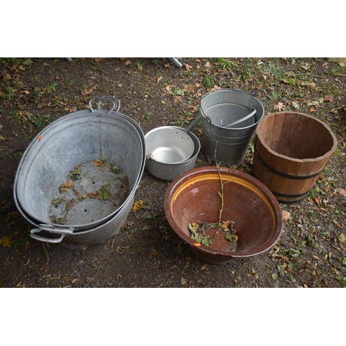 1008 - TWO SIZED GALVANISED BATHS, two buckets, etc, along with a modern coopered bucket and a glazed panth... 