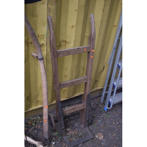 1010 - FOUR WOODEN GARDEN TOOLS, to include a sack truck, hay fork, scythe and a hedge cutter (4)