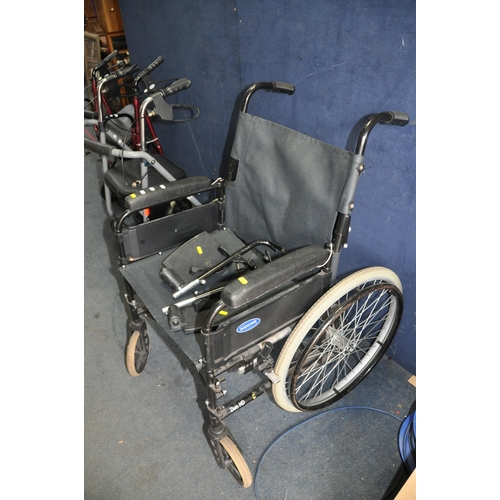 1053 - AN INVACARE WHEELCHAIR with two footrests and two Travelators (3)