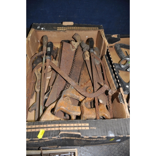 1057 - FOUR TRAYS CONTAINING VINTAGE TOOLS including thread gauges, tap holders, pick axe heads, secateurs,... 