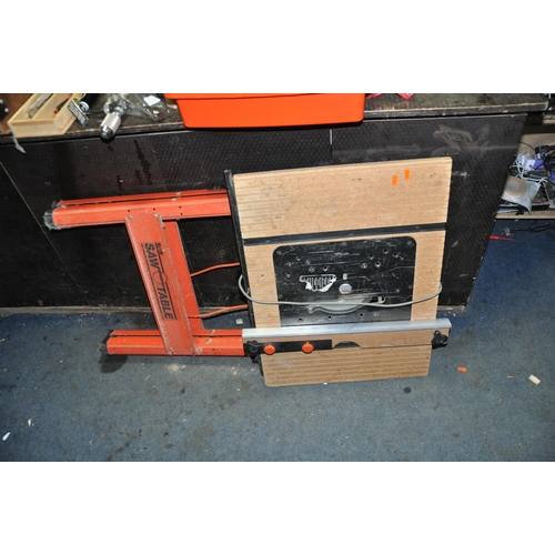 1078 - TWO TOOLBOXES AND A SAW TABLE CONTAINING TOOLS including Sandvik Quick clamps, a new Stanley brace, ... 