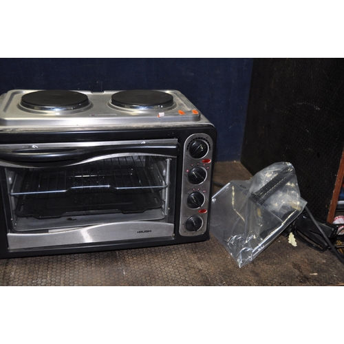 1103 - A BUSH MINI GRILL AND OVEN, a Panasonic microwave and a Supa Warm halogen heater (all PAT pass and w... 