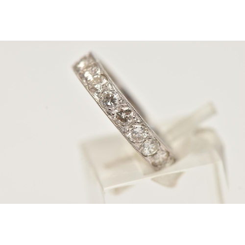 11 - A DIAMOND ETERNITY RING, designed as brilliant cut diamonds in a milligrain border, with engraved de... 