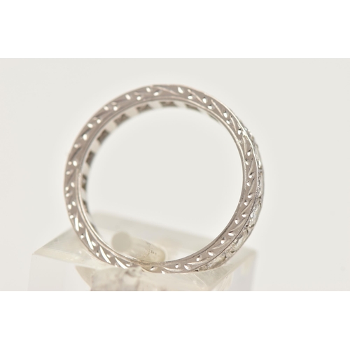 11 - A DIAMOND ETERNITY RING, designed as brilliant cut diamonds in a milligrain border, with engraved de... 