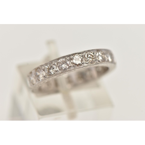 11 - A DIAMOND ETERNITY RING, designed as brilliant cut diamonds in a milligrain border, with engraved de... 