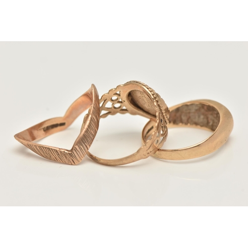 25 - THREE 9CT GOLD RINGS, the first a yellow gold textured wishbone ring, hallmarked 9ct Birmingham, rin... 