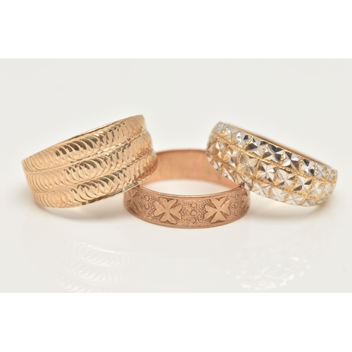 28 - TWO 9CT GOLD RINGS AND A YELLOW METAL RING, the first a wide tapering band ring with textured detail... 