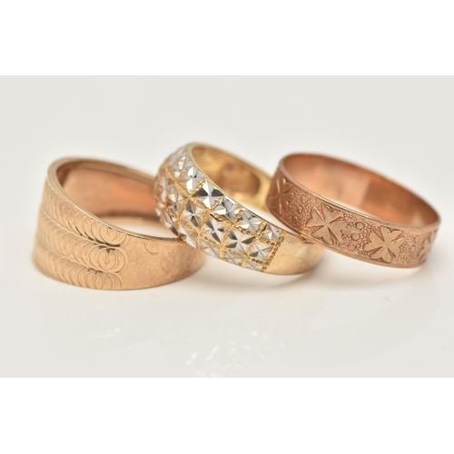 28 - TWO 9CT GOLD RINGS AND A YELLOW METAL RING, the first a wide tapering band ring with textured detail... 