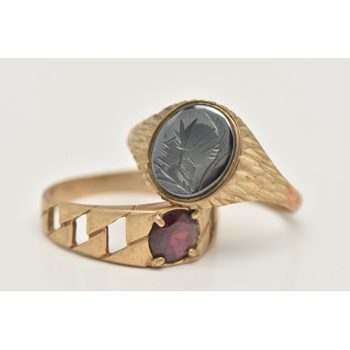 30 - TWO 9CT GOLD RINGS, the first a yellow gold oval signet set with hematite with a carved Centurian de... 