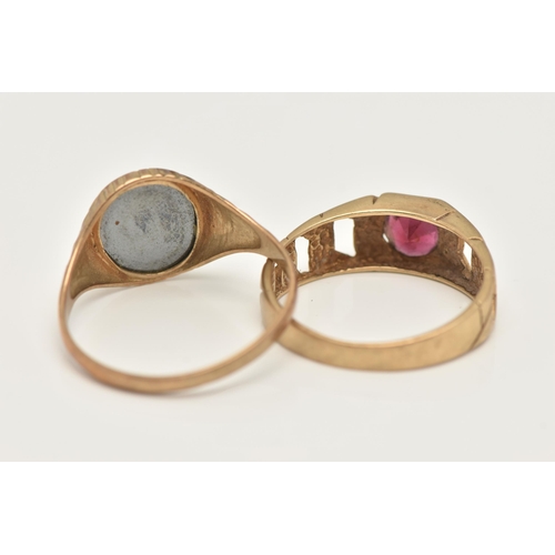 30 - TWO 9CT GOLD RINGS, the first a yellow gold oval signet set with hematite with a carved Centurian de... 