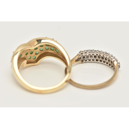 31 - TWO GEM SET RINGS, the first a cross over yellow gold ring pave set with twenty four circular cut em... 