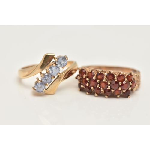 37 - TWO 9CT GOLD GEM SET RINGS, the first of a cross over design, with an asymmetrical row of four circu... 