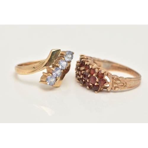 37 - TWO 9CT GOLD GEM SET RINGS, the first of a cross over design, with an asymmetrical row of four circu... 