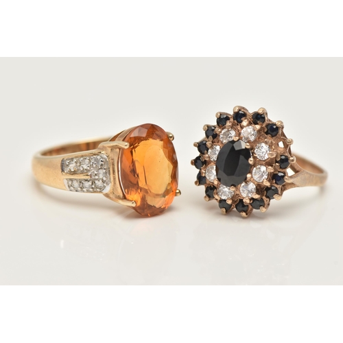 38 - TWO 9CT GOLD GEM SET RINGS, the first set with an oval cut citrine, four claw set to the colourless ... 