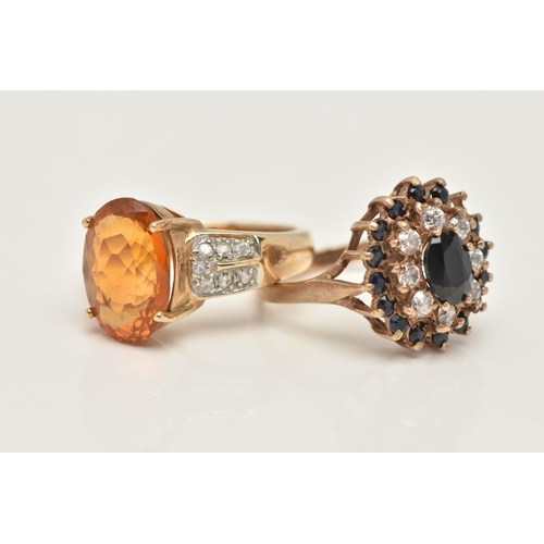 38 - TWO 9CT GOLD GEM SET RINGS, the first set with an oval cut citrine, four claw set to the colourless ... 