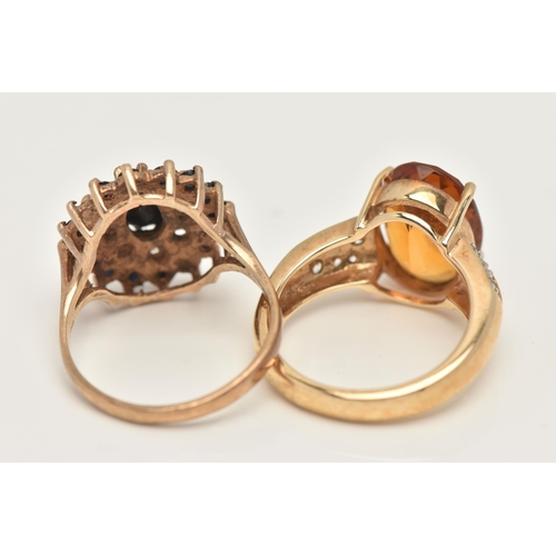 38 - TWO 9CT GOLD GEM SET RINGS, the first set with an oval cut citrine, four claw set to the colourless ... 