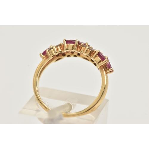 41 - AN 18CT GOLD RUBY AND DIAMOND RING, set with seven oval cut rubies and small round brilliant cut dia... 