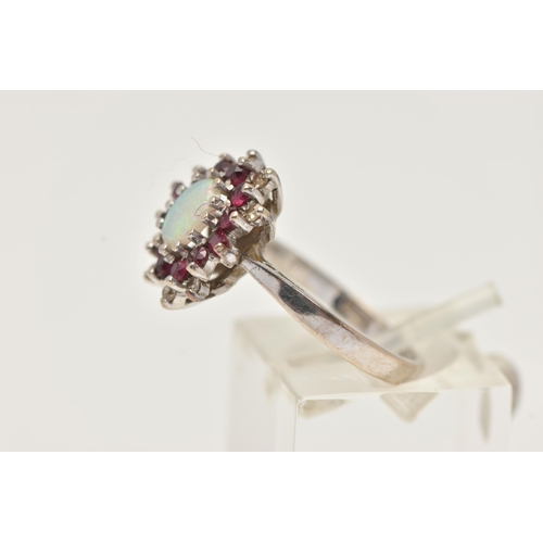 44 - AN 18CT WHITE GOLD OPAL, RUBY AND DIAMOND CLUSTER RING, of an oval form, set with a central oval cut... 