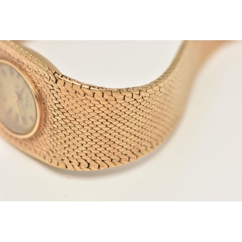 47 - A LADY'S OMEGA 9CT GOLD WRISTWATCH, the oval gold coloured face with baton markers to the mesh brace... 