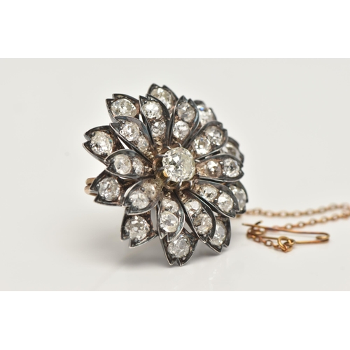 5 - A LATE VICTORIAN DIAMOND FLORAL BROOCH, set with a principal cushion-shape old-cut diamond, measurin... 