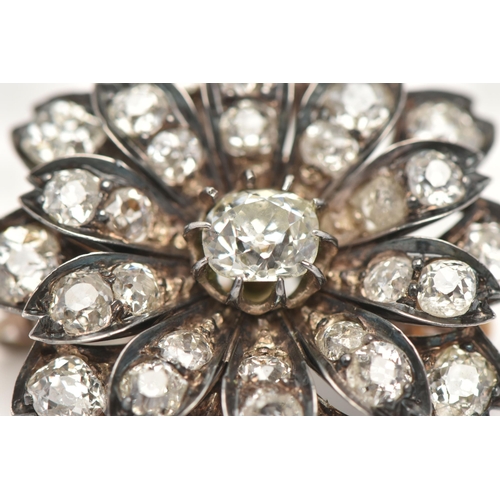 5 - A LATE VICTORIAN DIAMOND FLORAL BROOCH, set with a principal cushion-shape old-cut diamond, measurin... 