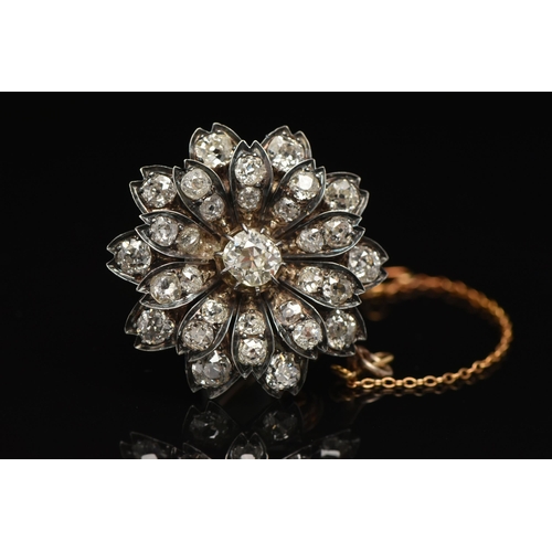 5 - A LATE VICTORIAN DIAMOND FLORAL BROOCH, set with a principal cushion-shape old-cut diamond, measurin... 