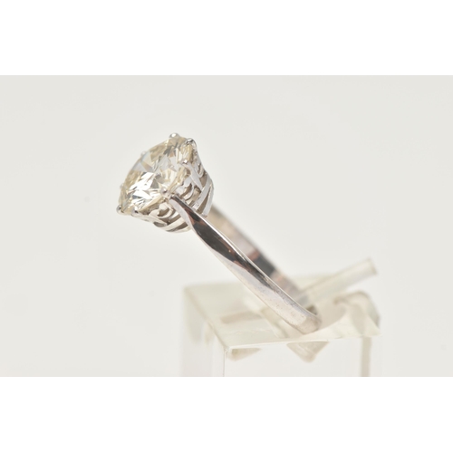 7 - A DIAMOND SINGLE STONE RING, set with a round brilliant cut diamond, within an eight claw setting, t... 