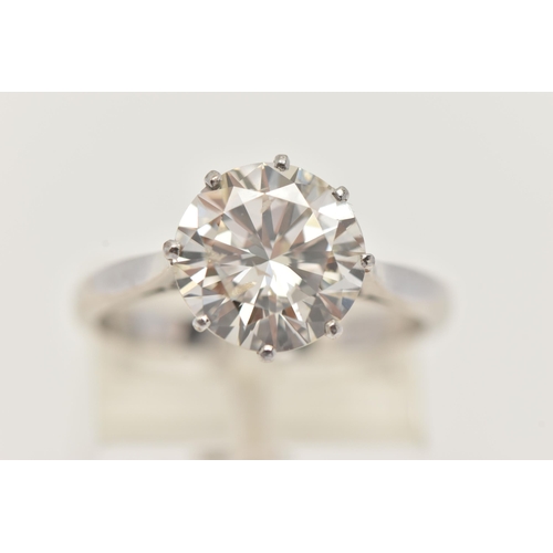 7 - A DIAMOND SINGLE STONE RING, set with a round brilliant cut diamond, within an eight claw setting, t... 