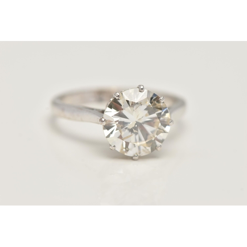 7 - A DIAMOND SINGLE STONE RING, set with a round brilliant cut diamond, within an eight claw setting, t... 