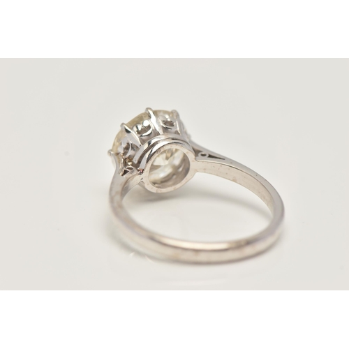 7 - A DIAMOND SINGLE STONE RING, set with a round brilliant cut diamond, within an eight claw setting, t... 