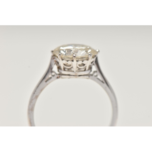 7 - A DIAMOND SINGLE STONE RING, set with a round brilliant cut diamond, within an eight claw setting, t... 