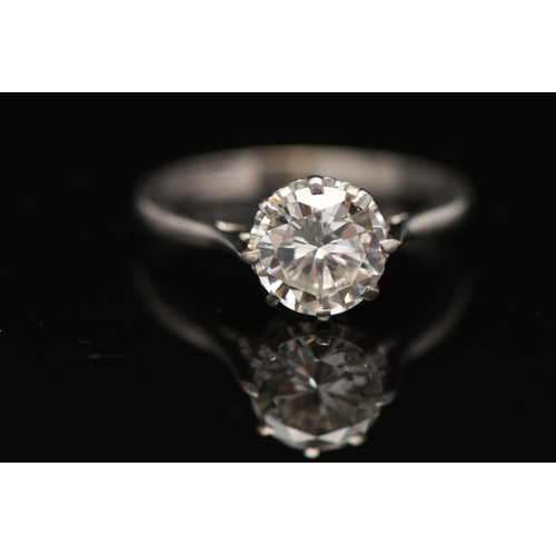 8 - A DIAMOND SINGLE STONE RING, set with a round brilliant cut diamond, within an eight claw setting, t... 