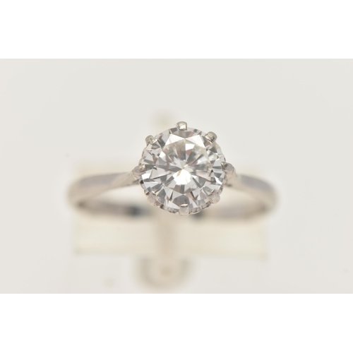 8 - A DIAMOND SINGLE STONE RING, set with a round brilliant cut diamond, within an eight claw setting, t... 