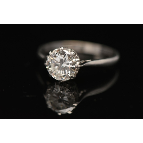 8 - A DIAMOND SINGLE STONE RING, set with a round brilliant cut diamond, within an eight claw setting, t... 