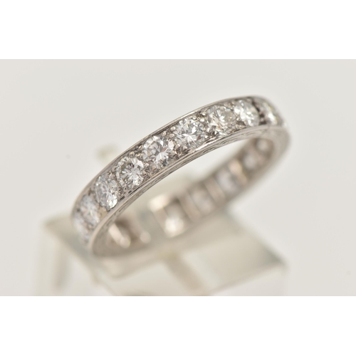 9 - A MID 20TH CENTURY WHITE METAL DIAMOND FULL CIRCLE ETERNITY RING, set with approximately twenty roun... 