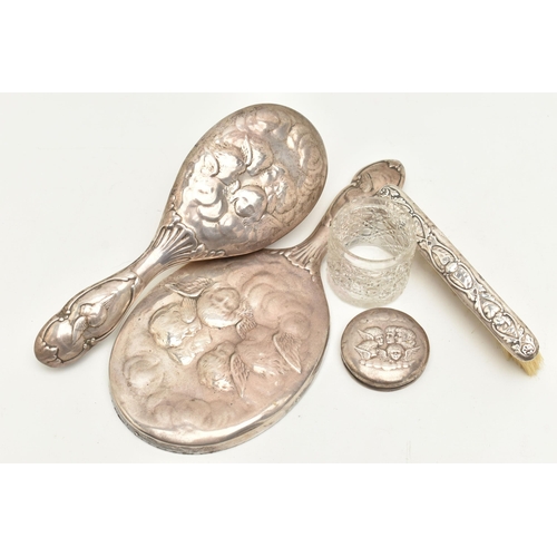 115 - A GEORGE V SILVER VANITY SET, to include a hand held mirror and hair brush with embossed cherub deta... 