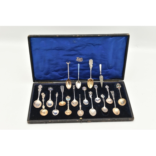 125 - A SELECTION OF EIGHTEEN SOUVENIR TEASPOONS AND A SILVER BOOKMARK, to include a blue enamel Marius Ha... 